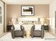 Inviting main bedroom showcasing a plush bed, stylish seating, and elegant decor for a serene retreat at 2820 Morning Song Way, Lancaster, SC 29720