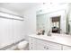 Bright bathroom with a large mirror, vanity, and shower-tub combination at 300 W 5Th St # 136, Charlotte, NC 28202