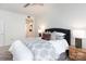 Cozy bedroom features a comfortable bed, ceiling fan, and plenty of natural light at 300 W 5Th St # 136, Charlotte, NC 28202