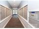 Carpeted hallway leading to a set of double doors at 300 W 5Th St # 136, Charlotte, NC 28202