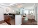 Open-concept living space with kitchen bar, dining area, and comfortable seating at 300 W 5Th St # 136, Charlotte, NC 28202