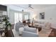 Bright living room with a ceiling fan and hardwood flooring at 300 W 5Th St # 136, Charlotte, NC 28202