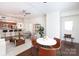 Open concept living, dining and kitchen with hardwood floors at 300 W 5Th St # 136, Charlotte, NC 28202