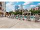 Relaxing pool area with lounge chairs and city views, perfect for enjoying sunny days at 300 W 5Th St # 136, Charlotte, NC 28202