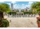 Resort style pool area, palm trees, lounge chairs and skyline views at 300 W 5Th St # 136, Charlotte, NC 28202