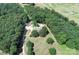 Picturesque aerial view of a secluded home surrounded by lush green forest, creating a private oasis at 3014 Haigler Rd, Monroe, NC 28110