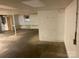 Unfinished basement with white brick walls, a door, and a window at 3014 Haigler Rd, Monroe, NC 28110