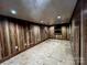 Unfinished basement offers a blank canvas with wood paneled walls, flooring, and recessed lighting at 3014 Haigler Rd, Monroe, NC 28110