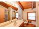 Classic bathroom featuring neutral-toned cabinets and countertops, with tub and shower combination at 3014 Haigler Rd, Monroe, NC 28110
