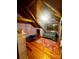 Bright, charming bedroom featuring wood floors, slanted ceilings, and whimsical suspended chair at 3014 Haigler Rd, Monroe, NC 28110