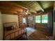 Cozy bedroom with wood walls and ceiling, creating a warm and inviting retreat at 3014 Haigler Rd, Monroe, NC 28110