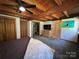 Spacious bedroom with wood beam ceilings, large closet, and an adjacent bathroom at 3014 Haigler Rd, Monroe, NC 28110