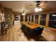 Sunlit dining room features wood floors, large windows, and a wooden dining table for gatherings at 3014 Haigler Rd, Monroe, NC 28110