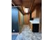 Hallway with a view of wood accents and stylish tile floor, blending rustic with chic design at 3014 Haigler Rd, Monroe, NC 28110