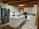 Bright kitchen with white cabinets, stainless appliances, and a kitchen island, perfect for cooking at 3014 Haigler Rd, Monroe, NC 28110