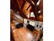Open living area with wooden floors, cozy sofas, and stair access to the loft area at 3014 Haigler Rd, Monroe, NC 28110