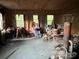 Rustic building interior, featuring storage solutions, with natural light, ideal for workspace or storage at 3014 Haigler Rd, Monroe, NC 28110