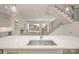 Open kitchen and living area with stainless steel appliances and hardwood floors at 3131 Providence Rd # 1A, Charlotte, NC 28211