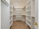 Spacious walk-in closet with custom shelving and ample storage space at 3131 Providence Rd # 1A, Charlotte, NC 28211