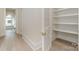 Hallway features a closet with shelving and backyard views through the window at 3131 Providence Rd # 1B, Charlotte, NC 28211