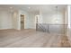 Hallway features an open floor plan, wood floors, modern lighting, and access to the laundry room at 3131 Providence Rd # 1B, Charlotte, NC 28211