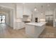 Stylish kitchen with a large island, stainless steel appliances, and hardwood flooring at 3131 Providence Rd # 1B, Charlotte, NC 28211