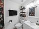 Clean, bright bathroom featuring floral shower curtain, shelving, and vanity at 4024 Seaforth Dr, Charlotte, NC 28205