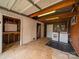 A utilitarian garage with a red brick wall, laundry appliances, and ample open space at 4024 Seaforth Dr, Charlotte, NC 28205