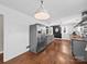 Spacious kitchen with stainless steel refrigerator, butcher block countertops, and wood flooring at 4024 Seaforth Dr, Charlotte, NC 28205