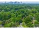 Scenic neighborhood view featuring lush green trees and a skyline in the distance at 4024 Seaforth Dr, Charlotte, NC 28205