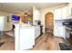 Open kitchen with white cabinets connecting to the dining and living spaces at 44429 Oriole Dr # 102, Indian Land, SC 29707