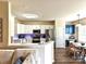 Bright kitchen with white cabinetry open to dining area, featuring stainless steel appliances at 44429 Oriole Dr # 102, Indian Land, SC 29707