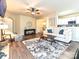 Open-concept living room with hardwood floors, neutral paint, and lots of natural light at 44429 Oriole Dr # 102, Indian Land, SC 29707