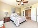 Comfortable main bedroom with ensuite bathroom, decorated with stylish art at 44429 Oriole Dr # 102, Indian Land, SC 29707