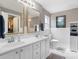 Bright bathroom with double vanity, subway tile, and ample storage space at 4626 Fairbluff Pl, Charlotte, NC 28209