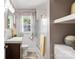 Stylish bathroom with a modern vanity, a glass-enclosed shower, and linen storage at 4626 Fairbluff Pl, Charlotte, NC 28209