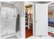 Bathroom with a walk-in shower and convenient access to the walk-in closet at 4626 Fairbluff Pl, Charlotte, NC 28209