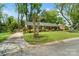 A charming brick home featuring a well-maintained lawn and a paved driveway at 4626 Fairbluff Pl, Charlotte, NC 28209