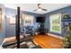 Home gym featuring workout equipment and a dedicated desk space at 4626 Fairbluff Pl, Charlotte, NC 28209