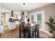Bright eat-in kitchen featuring stainless appliances and access to the backyard patio at 4626 Fairbluff Pl, Charlotte, NC 28209