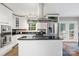 Modern kitchen with stainless steel appliances and a center island with gas cooktop at 4626 Fairbluff Pl, Charlotte, NC 28209