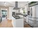Well-equipped kitchen with stainless steel appliances and a center island cooktop at 4626 Fairbluff Pl, Charlotte, NC 28209