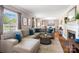 A spacious living room featuring a comfortable sectional sofa and a cozy fireplace at 4626 Fairbluff Pl, Charlotte, NC 28209