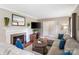 Inviting living room with fireplace and a large, comfortable sectional sofa at 4626 Fairbluff Pl, Charlotte, NC 28209