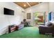 Finished shed interior with white walls, artificial turf, air conditioning, and backyard access at 4626 Fairbluff Pl, Charlotte, NC 28209