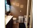 Cozy bathroom with a vanity, toilet, and bathtub, complemented by decor and storage solutions at 464 Laurel Fork Dr, Fort Mill, SC 29715