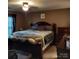 Bedroom with a comfortable bed, a nightstand, and a ceiling fan, perfect for rest and relaxation at 464 Laurel Fork Dr, Fort Mill, SC 29715
