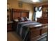 Bedroom with well-made bed, wooden furniture, and a window with natural light at 464 Laurel Fork Dr, Fort Mill, SC 29715