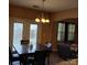 A charming dining area featuring modern lighting and french doors to the backyard at 464 Laurel Fork Dr, Fort Mill, SC 29715
