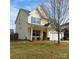 Charming two-story home with a manicured front yard, featuring a well-kept lawn and lush landscaping at 464 Laurel Fork Dr, Fort Mill, SC 29715